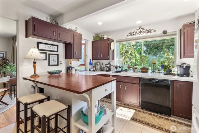 330 15th St, Snohomish, WA 98290 - kitchen featuring dishwasher, a breakfast bar, recessed lighting, dark brown cabinets, and a sink