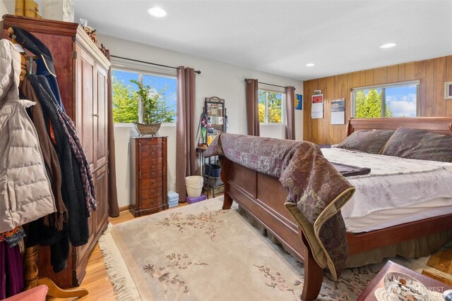 330 15th St, Snohomish, WA 98290 - bedroom with multiple windows, light wood-type flooring, recessed lighting, and wood walls