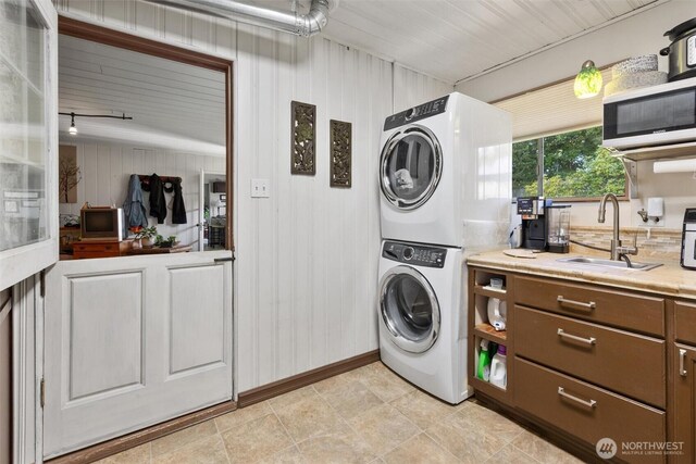 330 15th St, Snohomish, WA 98290 - laundry room with stacked washing machine and dryer and wood walls