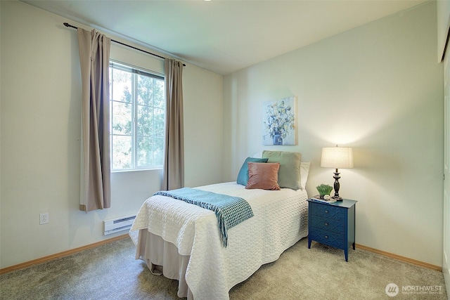 carpeted bedroom featuring baseboards and a baseboard radiator