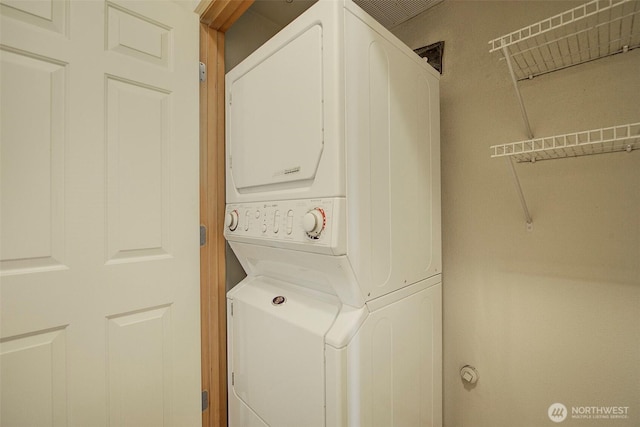 laundry room with laundry area and stacked washing maching and dryer