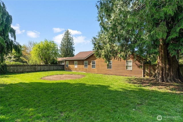 view of yard featuring a fenced backyard
