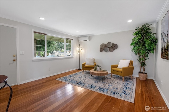 sitting room featuring crown molding, a wall mounted air conditioner, recessed lighting, and wood finished floors
