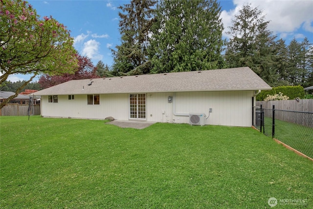 rear view of house featuring a lawn, a patio, ac unit, and a fenced backyard