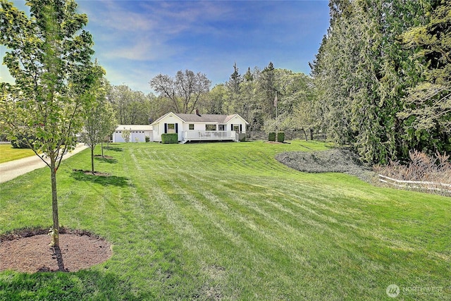 view of front of home with a front lawn and a deck