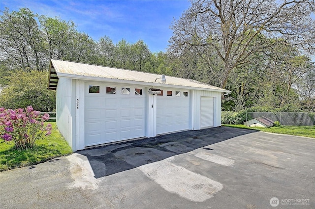 detached garage with fence
