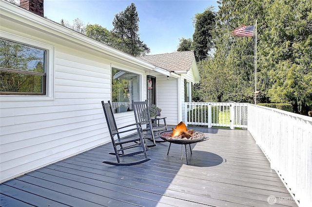 deck featuring a fire pit