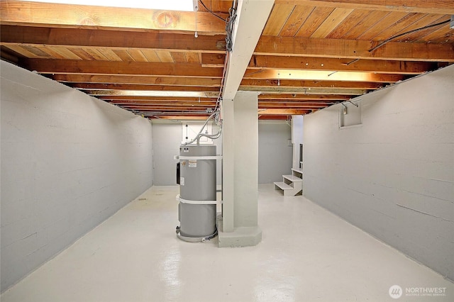 unfinished below grade area with stairs and secured water heater
