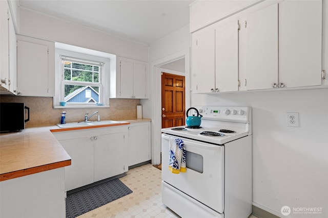 kitchen with a sink, light countertops, white electric range, and white cabinetry