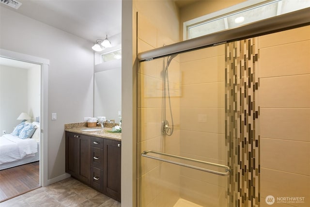 full bathroom with vanity, a shower stall, connected bathroom, and visible vents