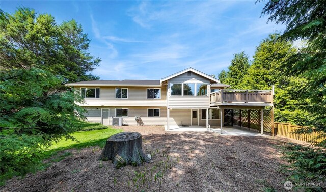 rear view of property with central AC, a patio area, a wooden deck, and fence