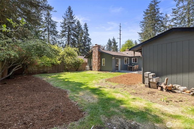 view of yard with a patio and fence