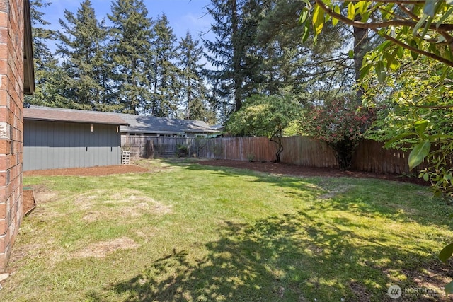 view of yard featuring a fenced backyard