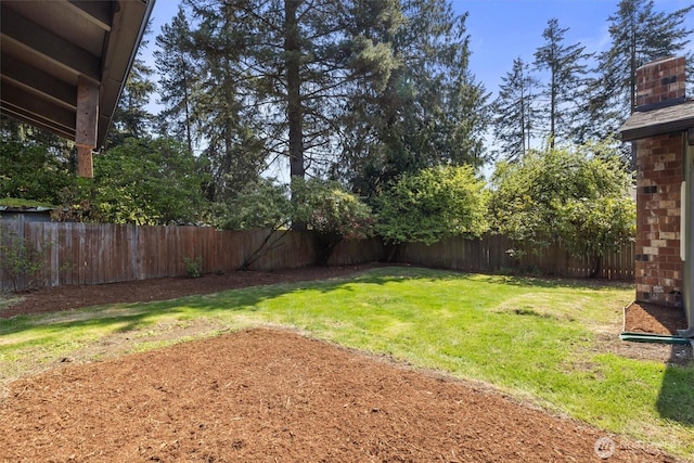 view of yard with a fenced backyard