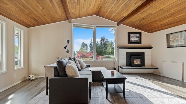 living area featuring wooden ceiling, vaulted ceiling with beams, and plenty of natural light