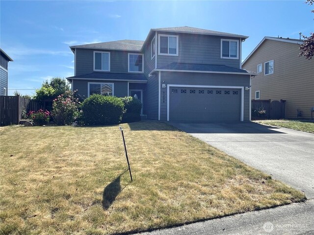 9206 Carys St SE, Yelm, WA 98597 - traditional-style house featuring driveway and an attached garage