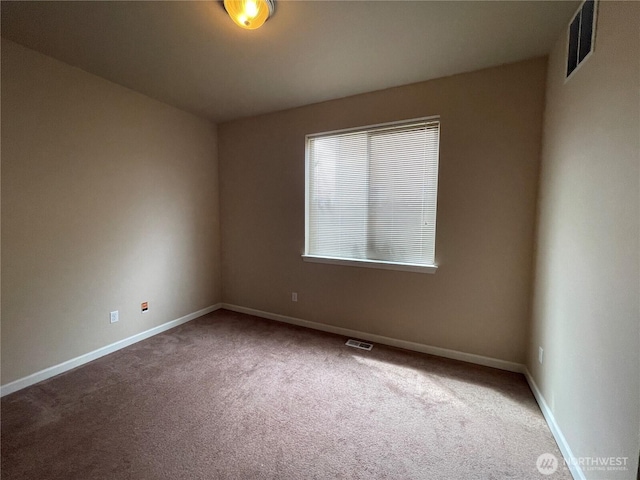 9206 Carys St SE, Yelm, WA 98597 - carpeted empty room with baseboards
