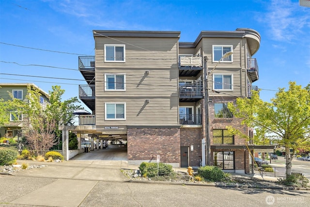 1400 N 80th St, Seattle, WA 98103 - exterior space featuring a carport, driveway, and brick siding