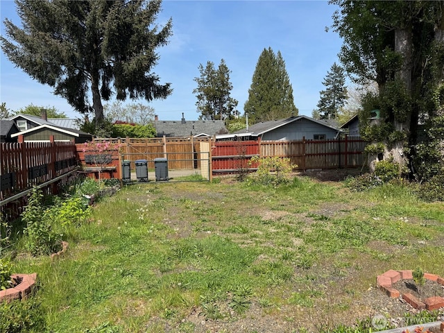 view of yard with a fenced backyard