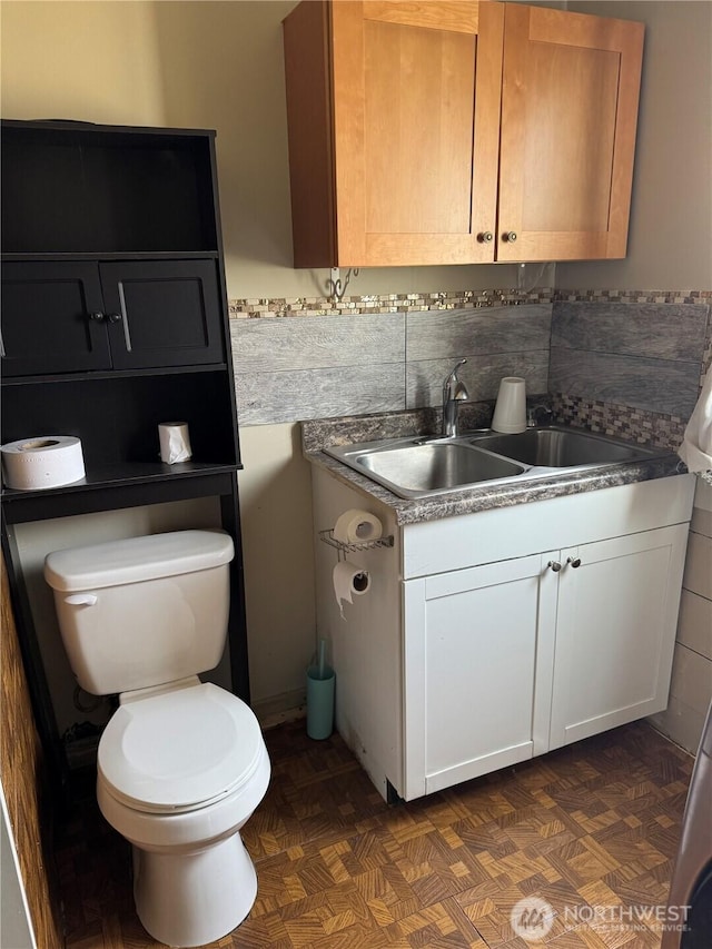bathroom with vanity and toilet