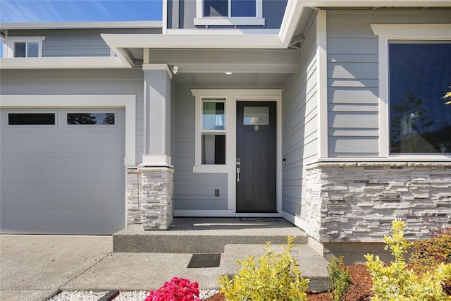 22125 Jameson Ave NW, Poulsbo, WA 98370 - entrance to property with stone siding and an attached garage