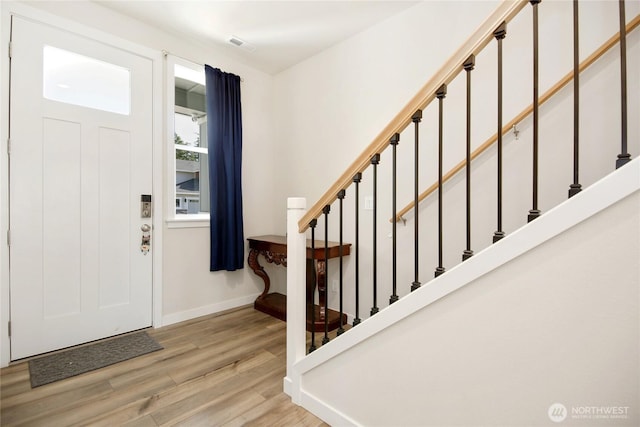 22125 Jameson Ave NW, Poulsbo, WA 98370 - foyer with light wood-type flooring, stairway, and baseboards
