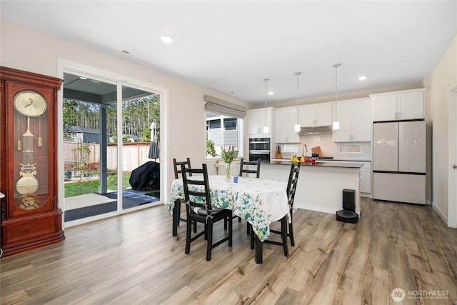 22125 Jameson Ave NW, Poulsbo, WA 98370 - dining area featuring light wood-type flooring and recessed lighting