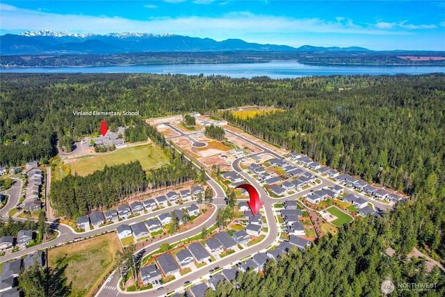 22125 Jameson Ave NW, Poulsbo, WA 98370 - aerial overview of property's location featuring a heavily wooded area and a water and mountain view