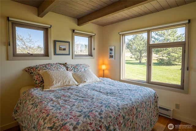 bedroom featuring beamed ceiling, a baseboard radiator, baseboards, wooden ceiling, and wood finished floors