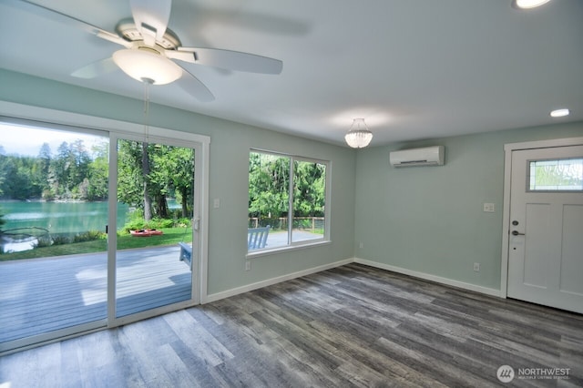 41 SE Wildcat Cove Rd, Shelton, WA 98584 - doorway with a wall mounted air conditioner, healthy amount of natural light, baseboards, and wood finished floors