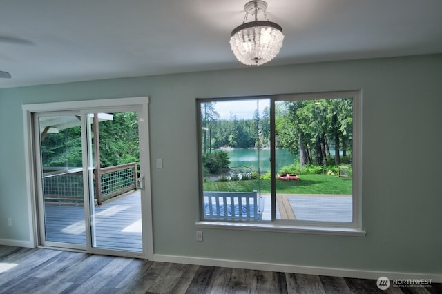 41 SE Wildcat Cove Rd, Shelton, WA 98584 - doorway with healthy amount of natural light, a chandelier, baseboards, and wood finished floors