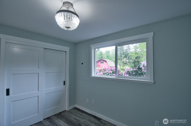 41 SE Wildcat Cove Rd, Shelton, WA 98584 - unfurnished bedroom with dark wood-type flooring, baseboards, and a closet