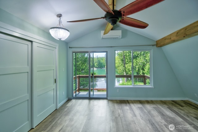 41 SE Wildcat Cove Rd, Shelton, WA 98584 - unfurnished bedroom featuring a wall mounted AC, access to exterior, wood finished floors, and baseboards