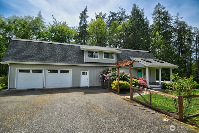 41 SE Wildcat Cove Rd, Shelton, WA 98584 - view of front of home featuring driveway, an attached garage, and a shingled roof