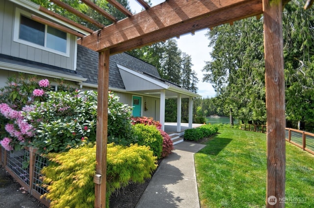 41 SE Wildcat Cove Rd, Shelton, WA 98584 - view of yard with covered porch, a pergola, and a water view