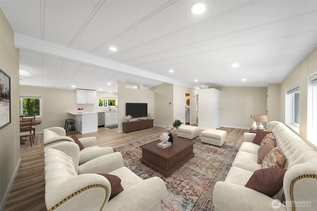 602 165th Street Ct E Unit 37, Spanaway, WA 98387 - living area with beamed ceiling, recessed lighting, light wood-style flooring, and baseboards