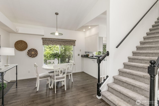 dining area with dark wood finished floors, baseboards, recessed lighting, and stairs