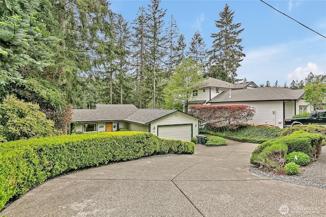 view of front of house with concrete driveway and a garage