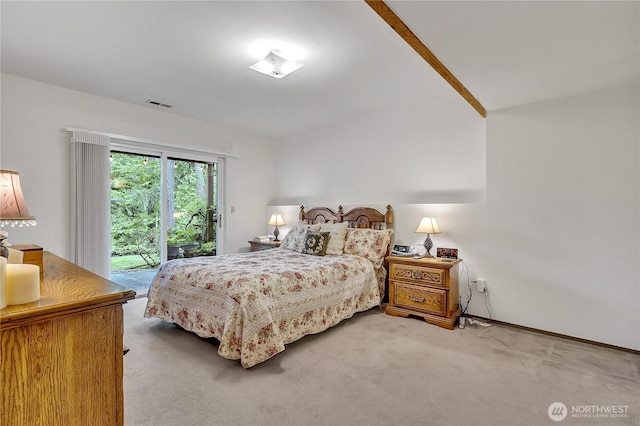 bedroom with access to outside and carpet