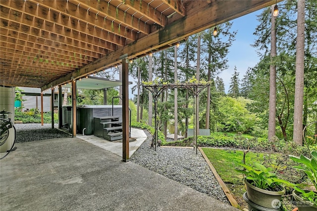 view of patio with a hot tub