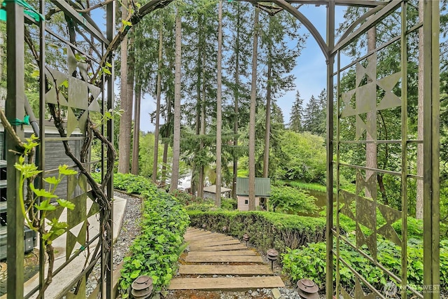 view of yard with view of wooded area
