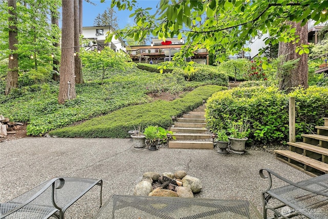 view of yard with stairs and a patio