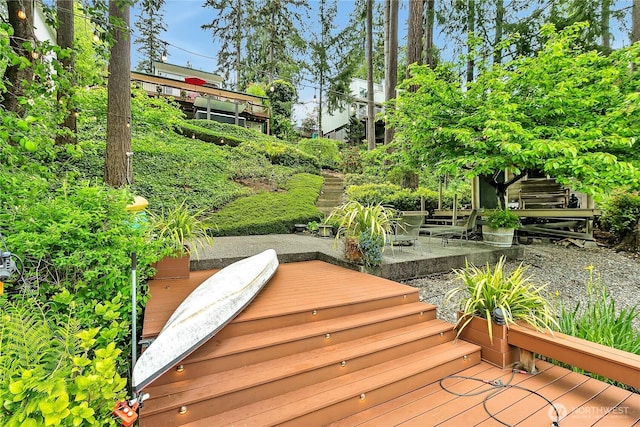 wooden deck with a patio area