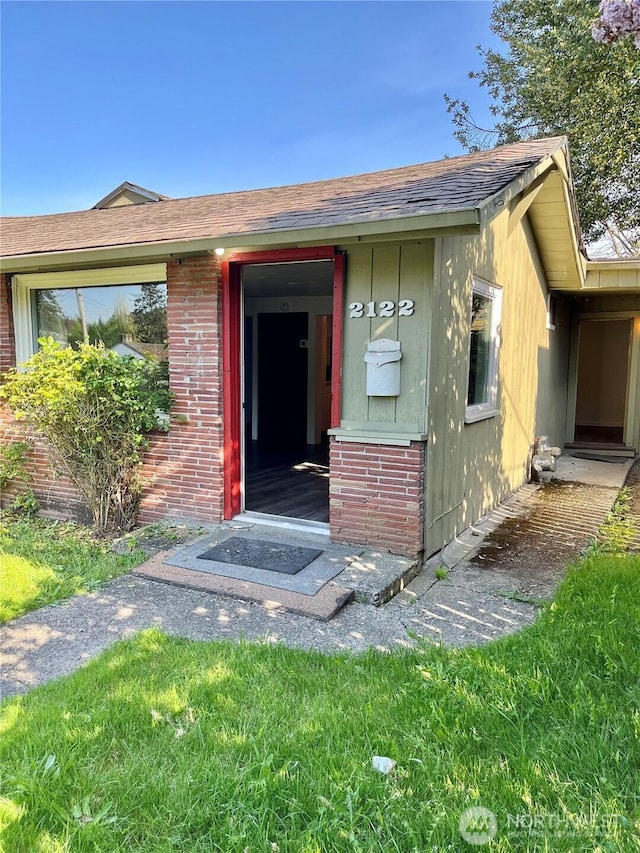 2122 15th St, Bremerton, WA 98312 - property entrance featuring brick siding and roof with shingles