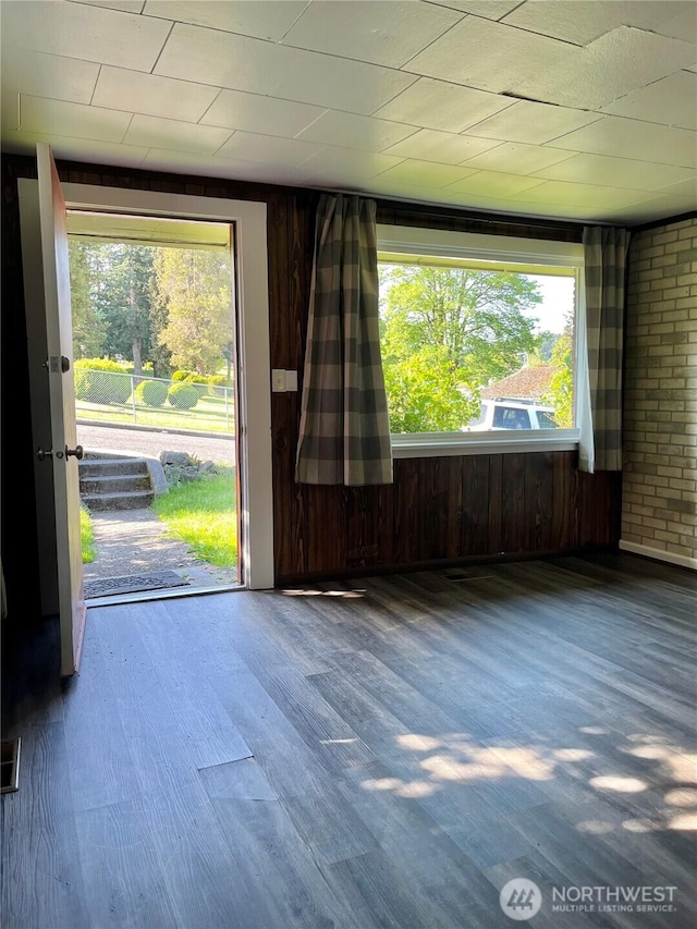 2122 15th St, Bremerton, WA 98312 - spare room featuring wood walls and wood finished floors