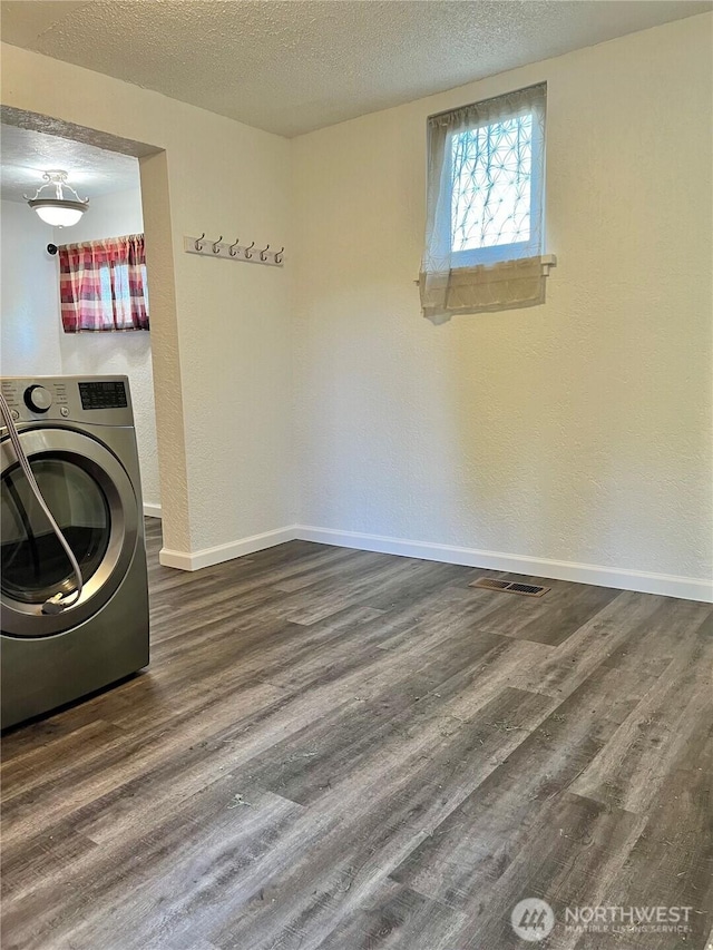 2122 15th St, Bremerton, WA 98312 - clothes washing area featuring a textured ceiling, wood finished floors, washer / clothes dryer, and baseboards