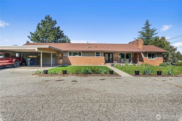 780 10th St NE, East Wenatchee, WA 98802 - ranch-style home with an attached garage, an attached carport, a front yard, and brick siding