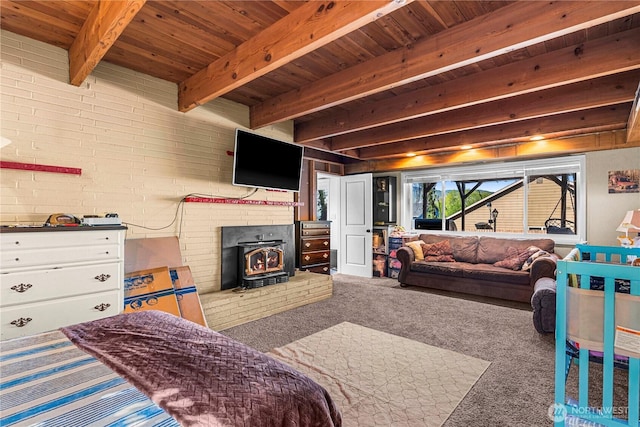 780 10th St NE, East Wenatchee, WA 98802 - carpeted bedroom featuring a wood stove and a wooden ceiling with exposed beams