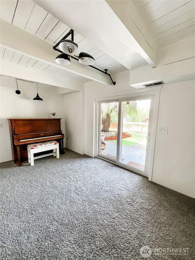 780 10th St NE, East Wenatchee, WA 98802 - unfurnished living room with carpet floors and a wooden ceiling with exposed beams