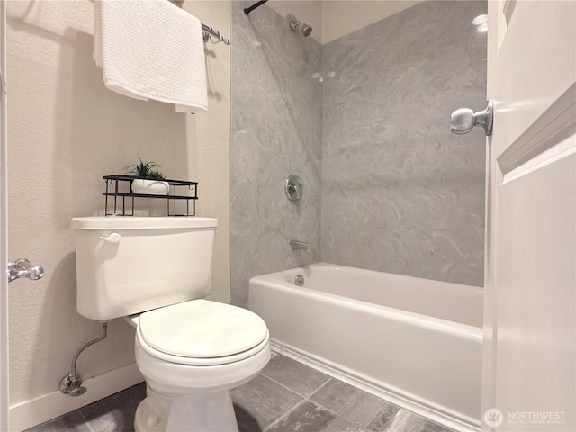 7309 Sand Point Way NE Unit B727, Seattle, WA 98115 - bathroom with washtub / shower combination, toilet, and tile patterned flooring